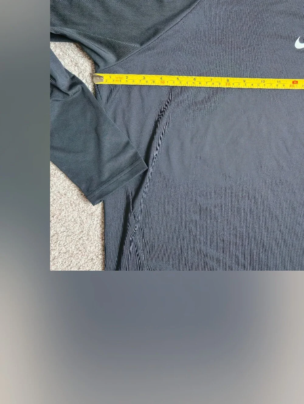 Nike Swim Dri-FIT long-sleeve Rashguard features a classic athletic crewneck